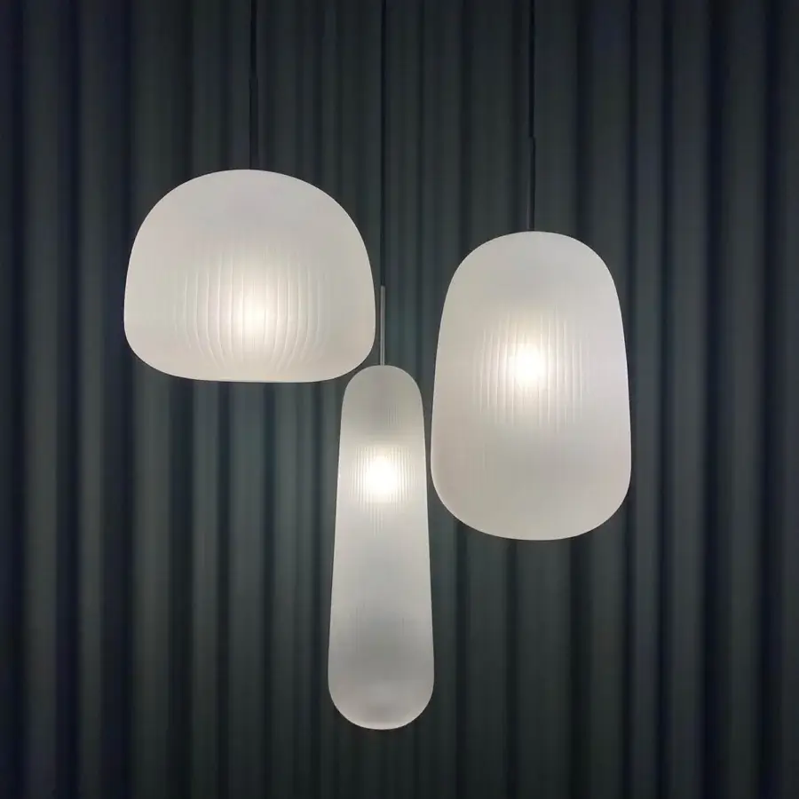 Exceptional melogranoblu Api suspension lamp crafted in sapphire pleated blown glass with a black coated fabric cable