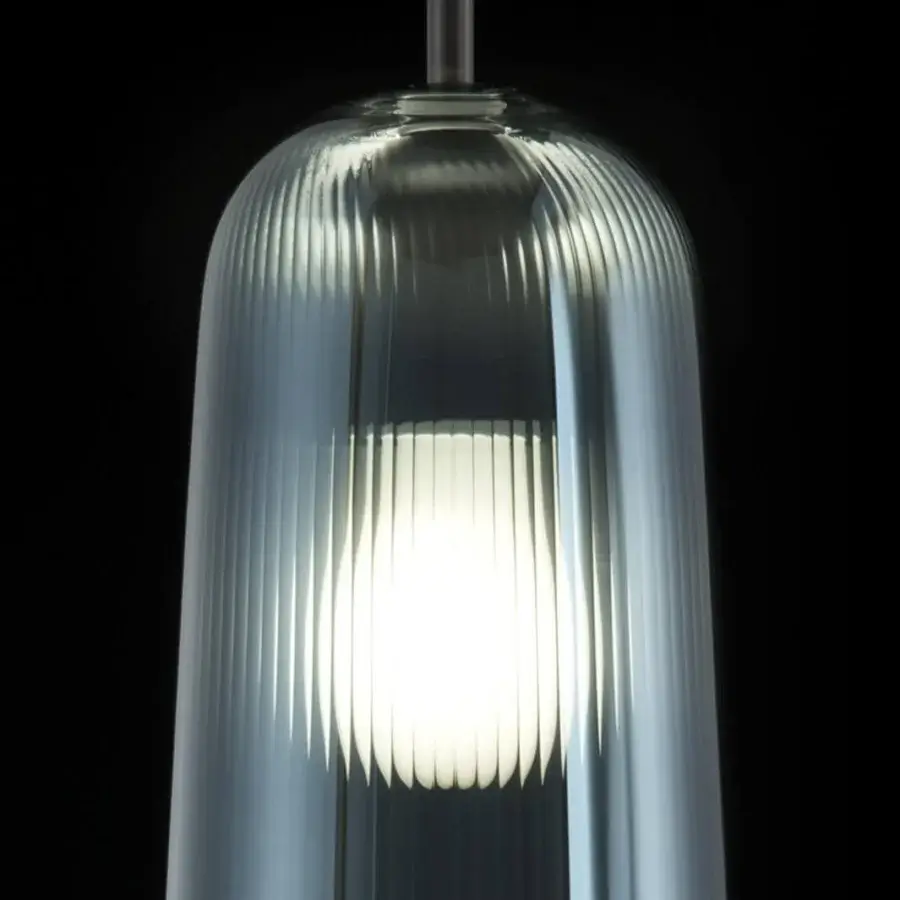 Luxury melogranoblu Api suspension lamp crafted in sapphire pleated blown glass with white inner diffuser and black coated fabric cable