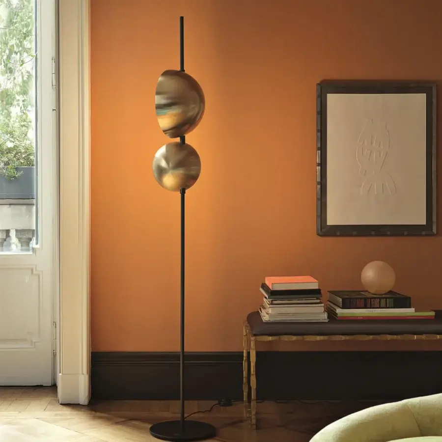 Distinguished Oluce Superluna floor lamp crafted in black metal with gradient coppery orange to golden shades