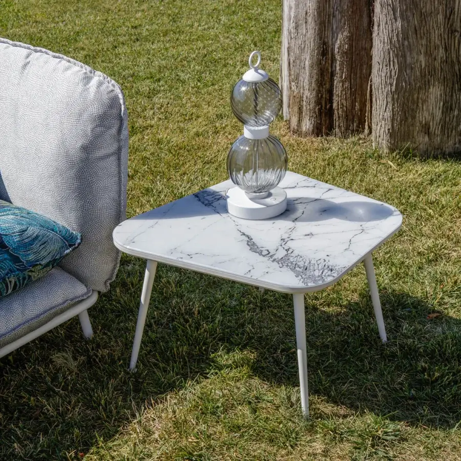Refined Sicis Filicudi side & coffee table with a marble-patterned Vetrite tabletop and matte white lacquered conical aluminum legs