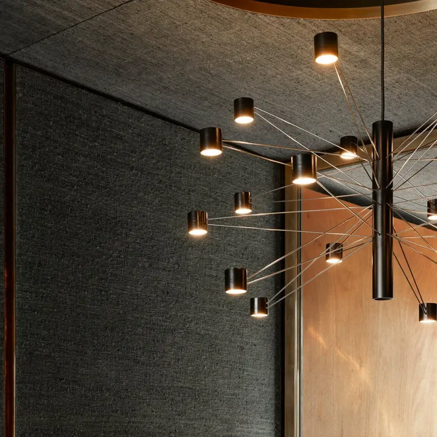 Elegant Kundalini Polar Suspension Lamp crafted in metal with a matte dark finish and dynamic radial arms