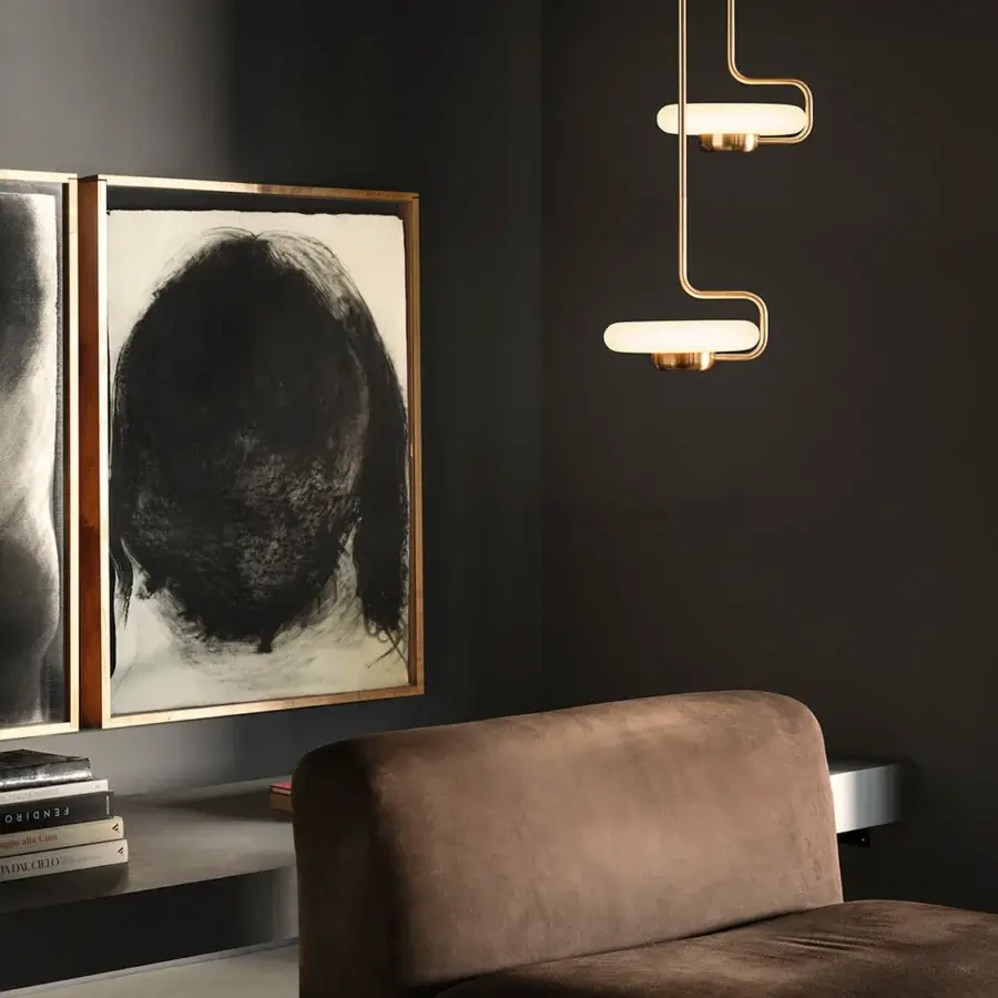 Distinguished Kundalini Tratto suspension lamp crafted in warm gold tone metal and opal glass with a satin finish