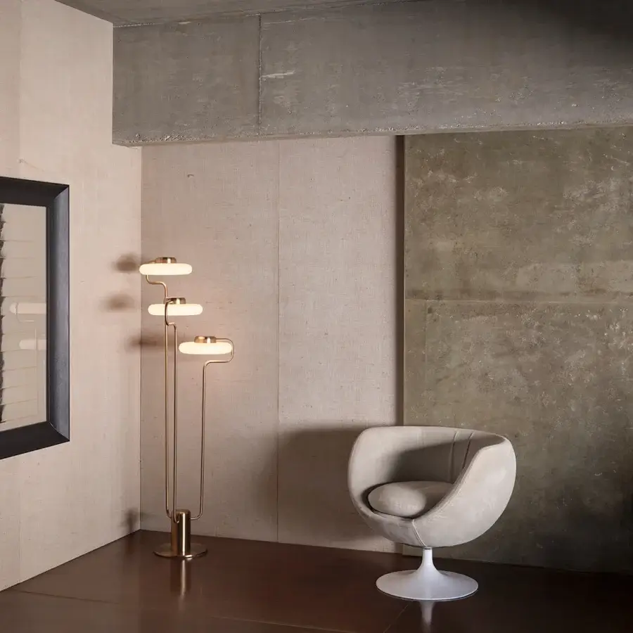 Captivating Kundalini Tratto floor lamp crafted in metal and opal glass with a warm muted gold finish