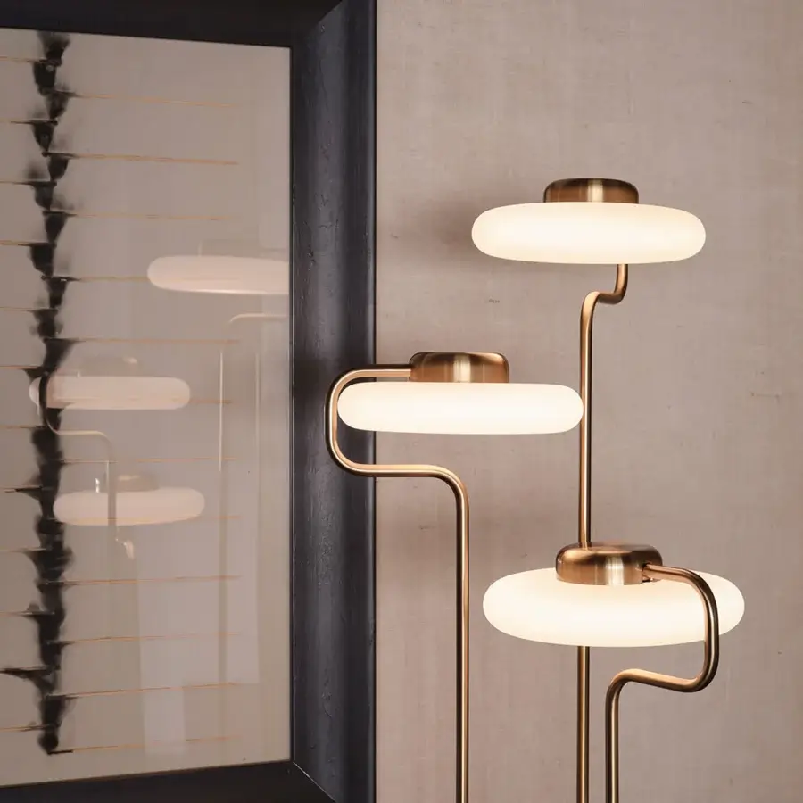 Distinguished Kundalini Tratto floor lamp crafted in metal and opal glass with a satin brass finish