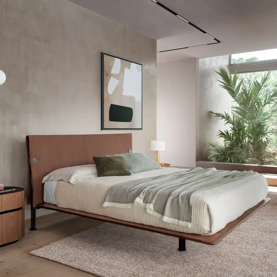Distinguished Presotto Dress Code bed with reddish-brown textile and wood veneer, built with sleek black metal feet and integrated nightstand