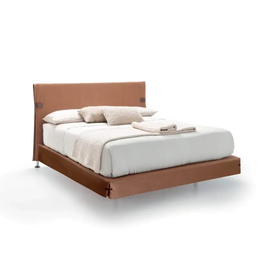 Elegant Presotto Dress Code bed with terracotta fabric upholstery and leather detailing, built with sleek metal feet