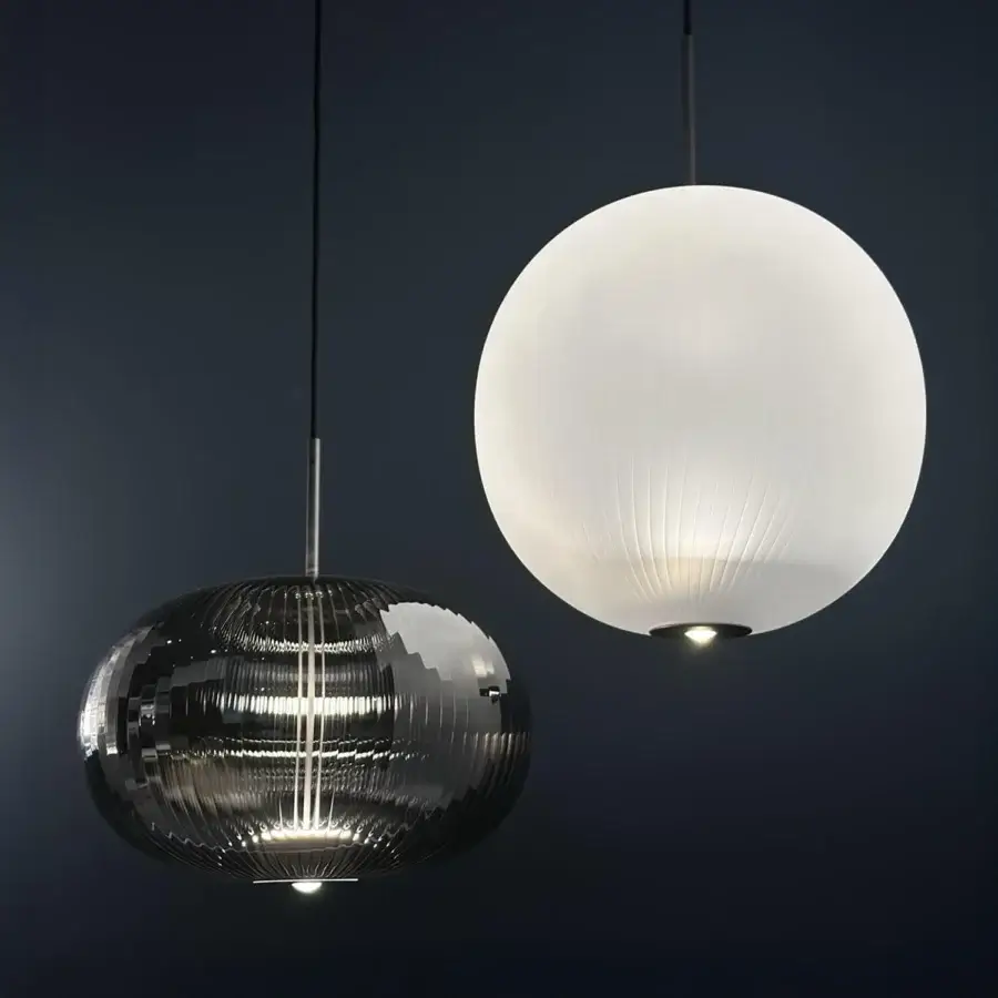 Distinguished melogranoblu Mahidevran suspension lamp with handblown ruled glass and darkly metallic faceted surface offering delicate illumination