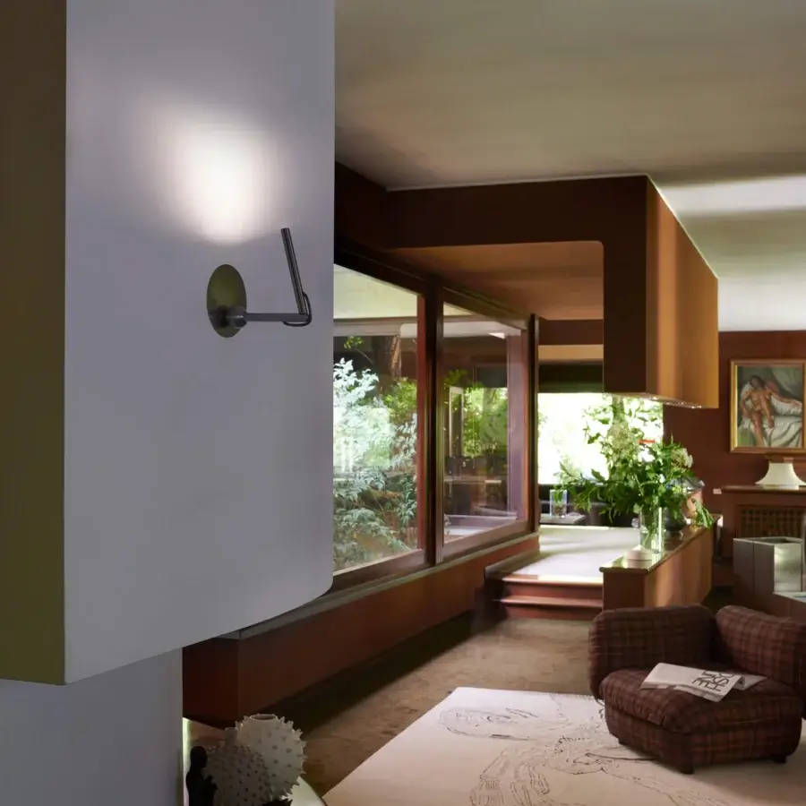 Distinguished Oluce Calamaio wall lamp built in metal with a crisp white finish and dark metallic mounting