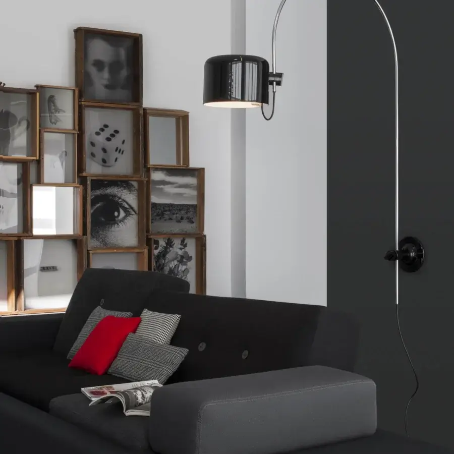 Exceptional Oluce Coupé wall lamp delivering directional light with a satin black metal finish and glossy shade interior