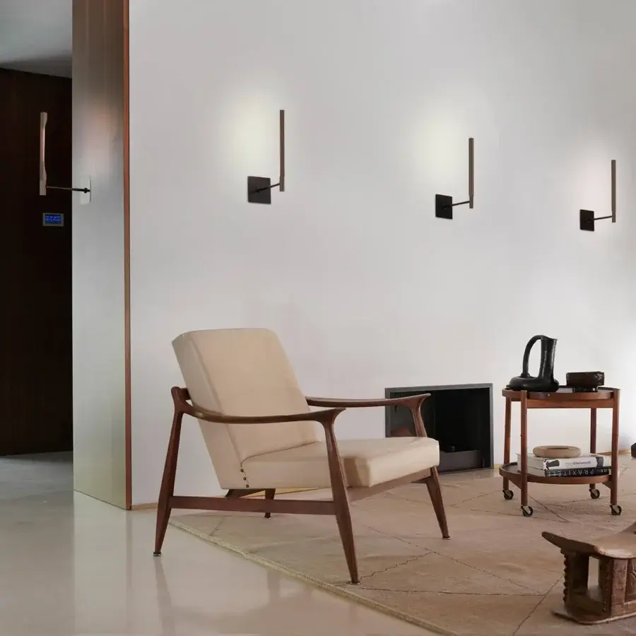 Superior Oluce Ilo wall lamp crafted in aluminum with matte black finish and pivoting design