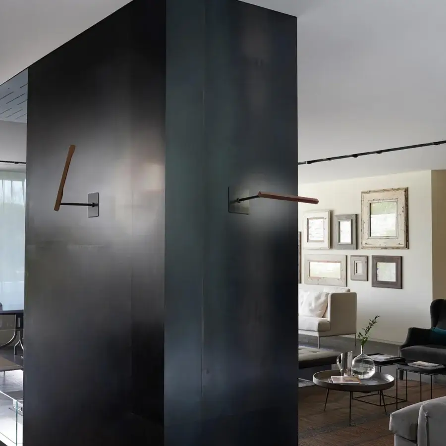 Elegant Oluce Ilo wall lamp crafted in aluminum with sleek matte muted gray finish allowing versatile positioning