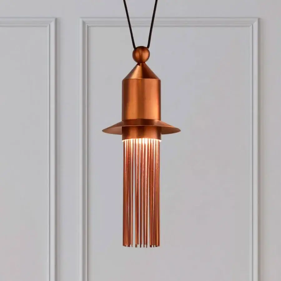 Distinguished Masiero Nappe suspension lamp crafted in warm copper painted metal with vertical rods diffusing ambient glow