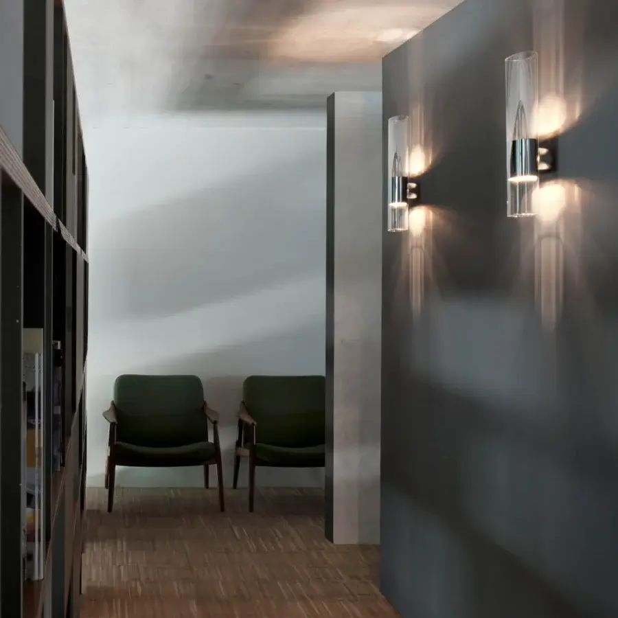 Exclusive Oluce Line wall lamp in polished aluminum with oval Pyrex glass emitting diffused upward and downward glow