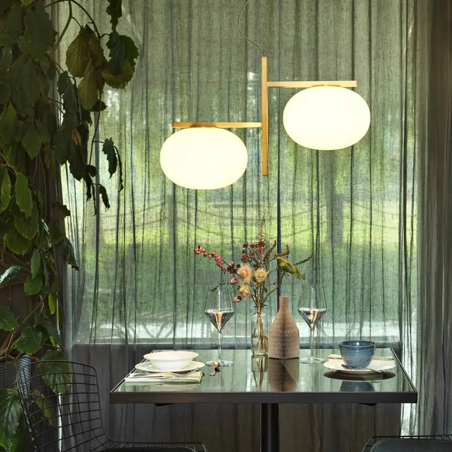 Exceptional Oluce Alba suspension lamp in opaline glass with a brass-finished metal structure delivering a diffused glow