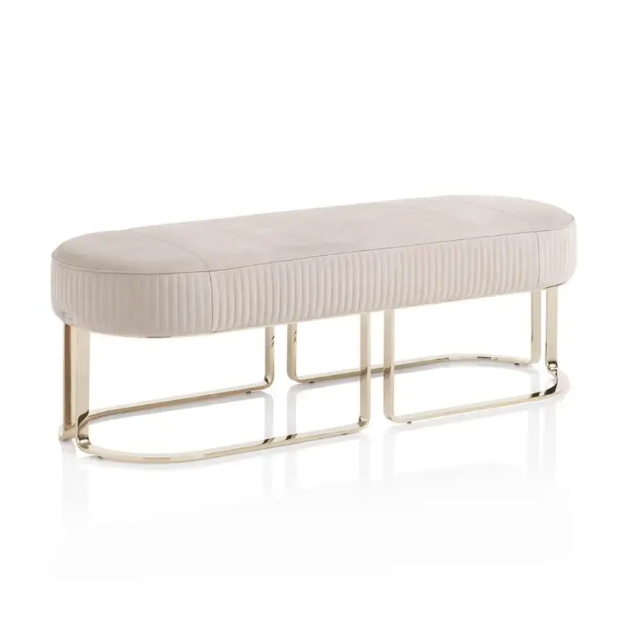 Soho bench, light beige velvet upholstery, brushed gold metal frame with double-arched, rectangular grid base, modern minimalist design.