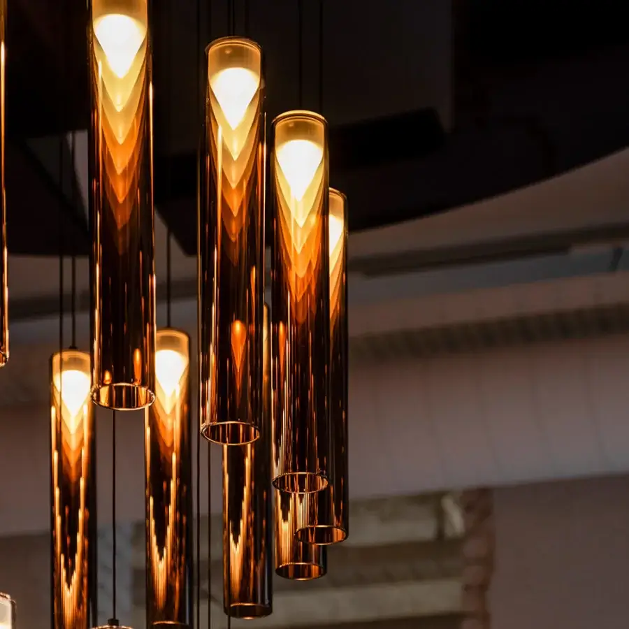 Distinguished Penta Iconica suspension lamp crafted in polished borosilicate glass with a frosted conical form and warm amber glow