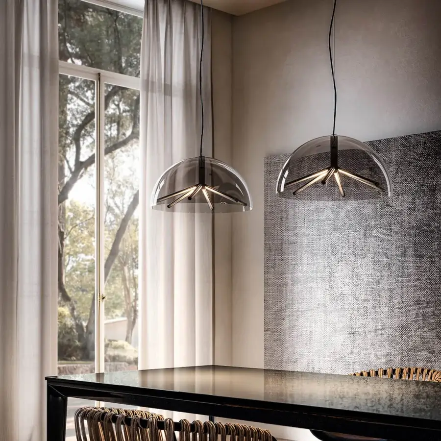 Superior Penta Runa suspension lamp crafted in clear borosilicate glass and dark-toned steel with a graceful curved internal structure