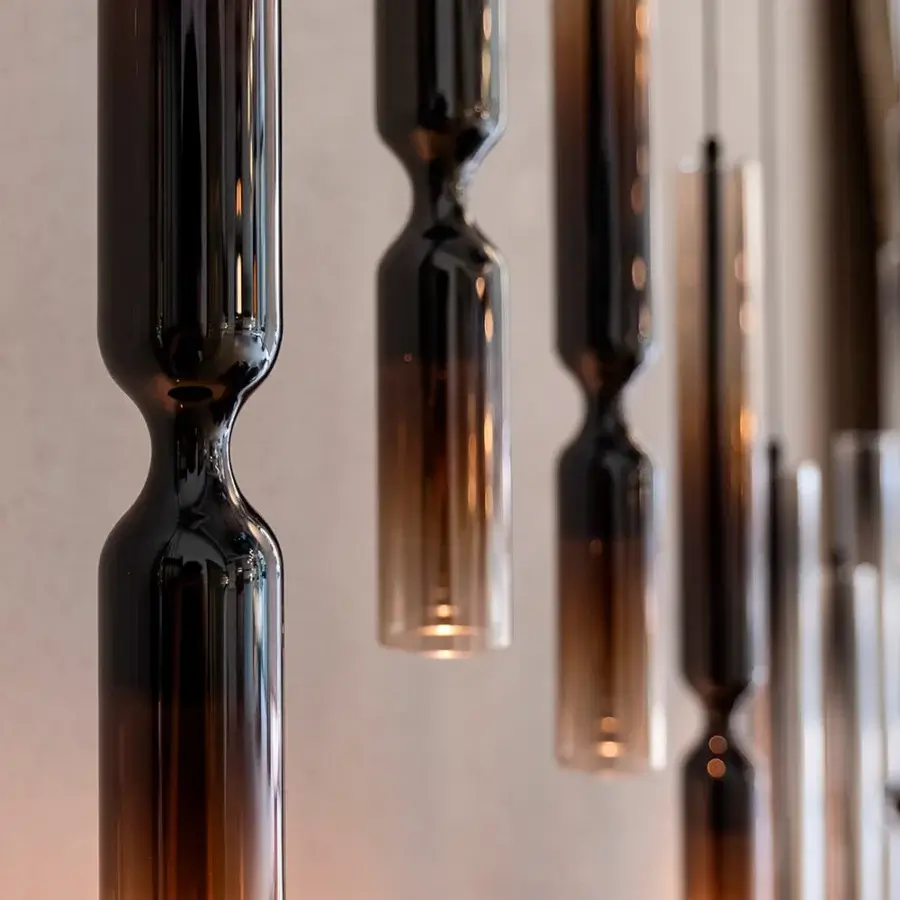 Superior Penta Misty suspension lamp crafted in double glass and metallic aluminum with a deep amber gradient finish