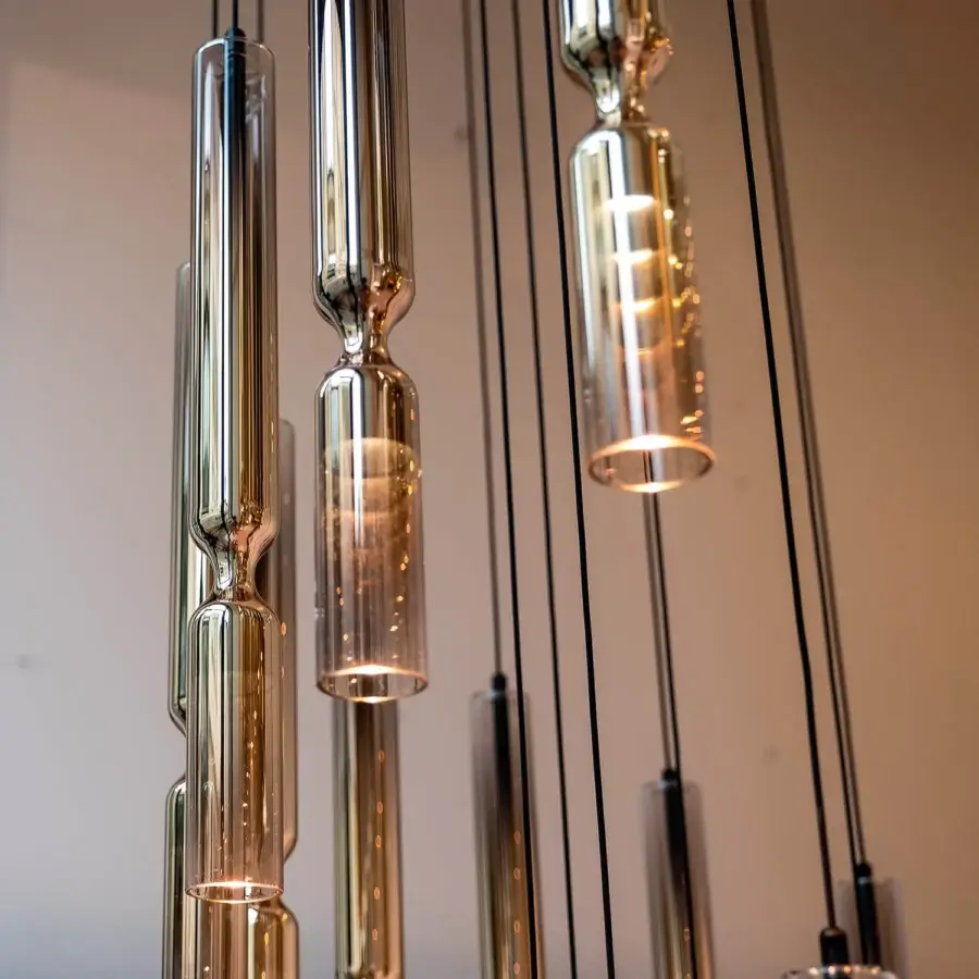 Distinguished Penta Misty suspension lamp crafted in double glass with a metallic core and golden-amber transparent finish