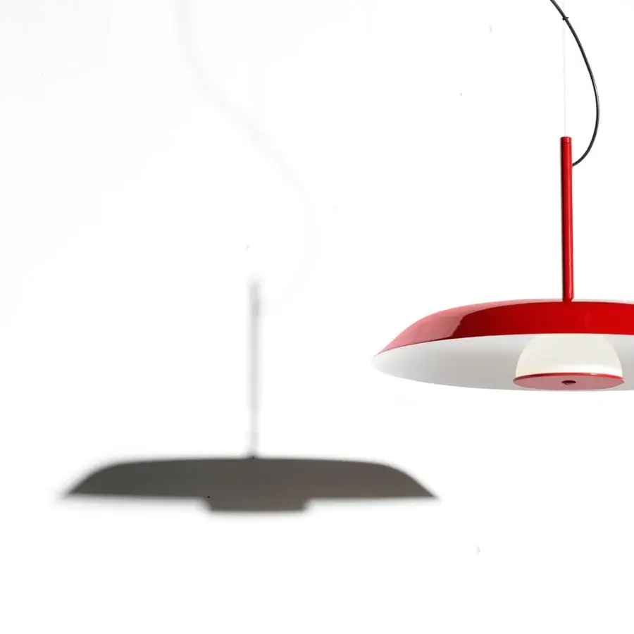 Distinguished Oluce Iride suspension lamp crafted in metal with glossy red exterior and opaline glass diffuser