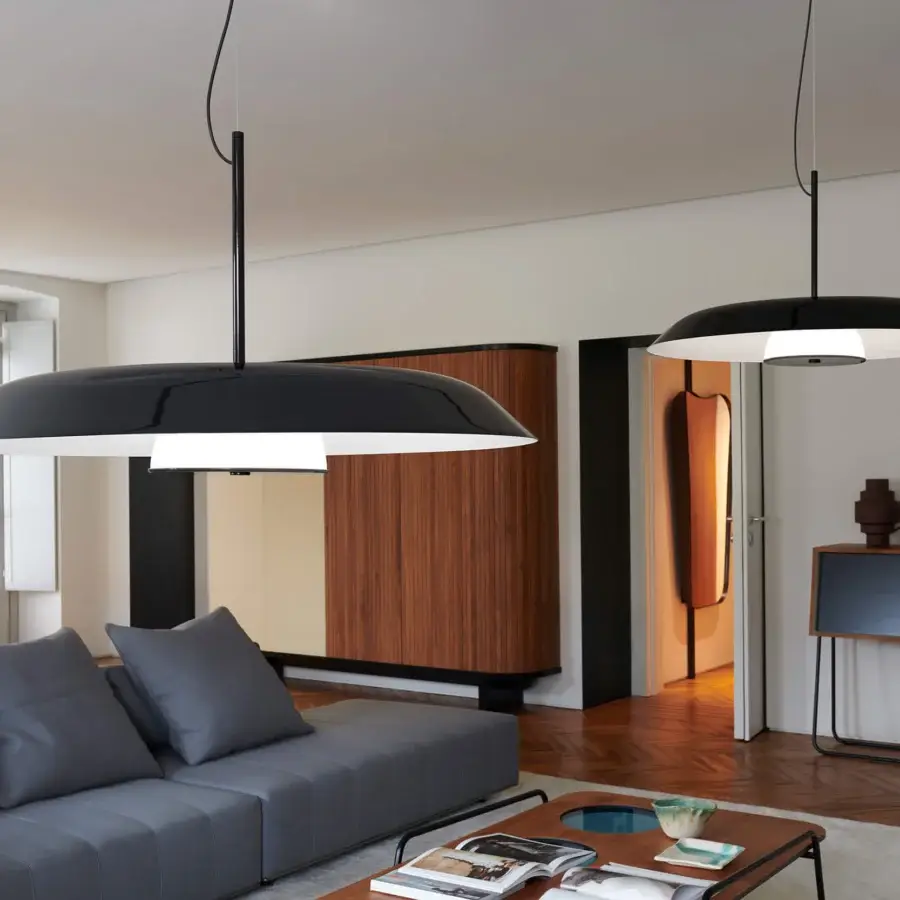Superior Oluce Iride suspension lamp crafted in metal with a black exterior and reflective white interior, delivering a satin finish