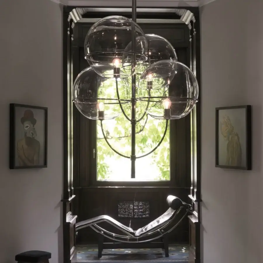 Distinguished Oluce Lyndon suspension lamp crafted in dark matte metal with a cluster of transparent glass shades