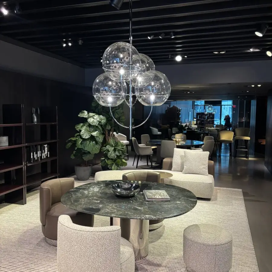 Elegant Oluce Lyndon suspension lamp with five clear glass spheres and glossy dark-toned metal construction