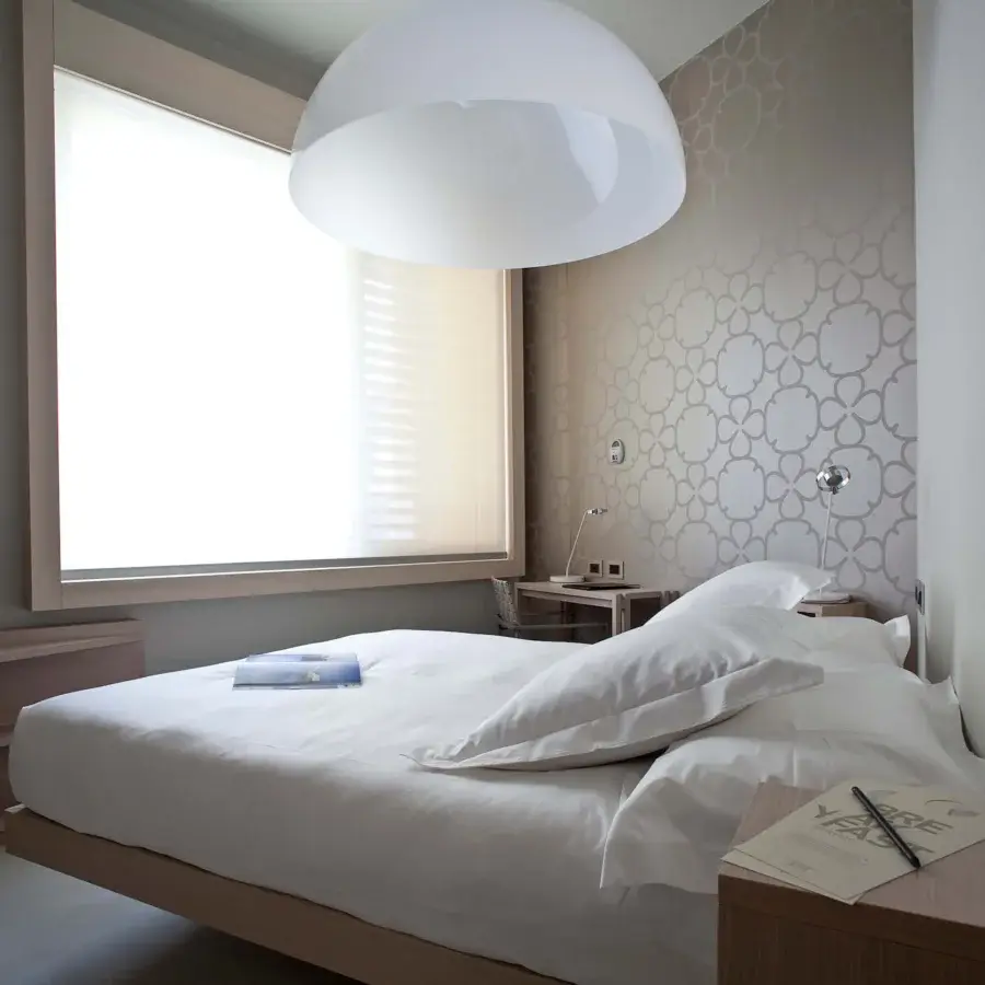 Distinguished Oluce Sonora lamp suspension crafted in Italy with translucent synthetic material and matte white finish