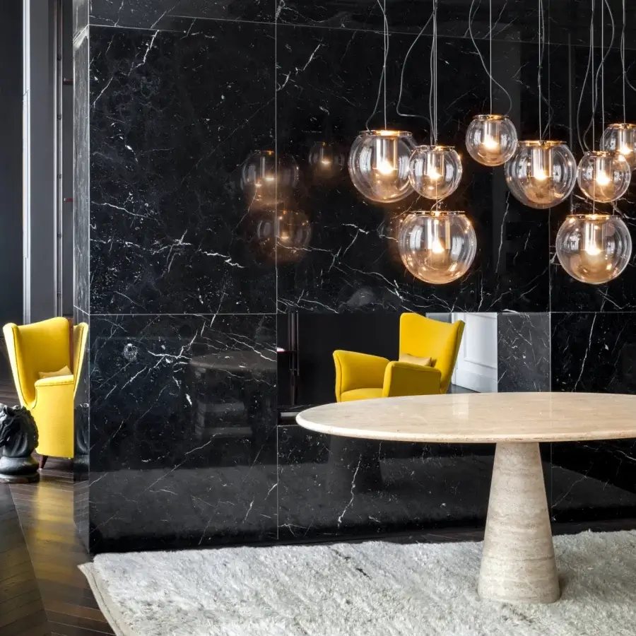 Elegant Oluce The Globe suspension lamp in transparent hand-blown glass with a polished golden metal reflector