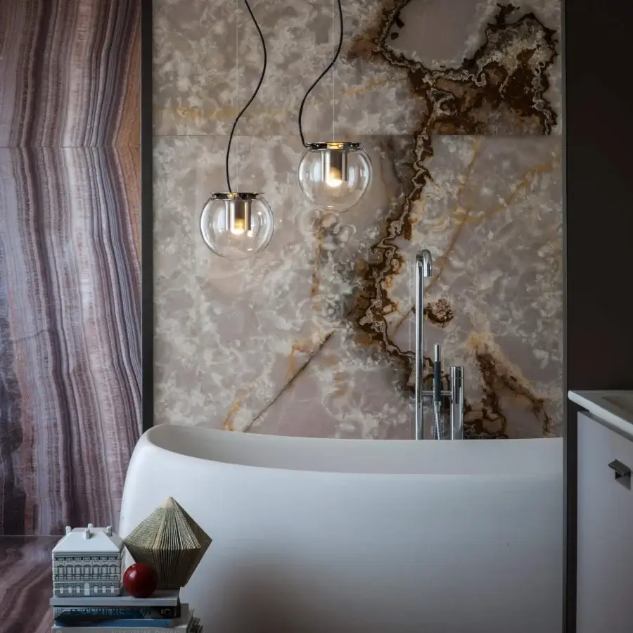 Superior Oluce The Globe suspension lamp crafted in clear blown-glass with dark-toned metal frames creating a flowing composition