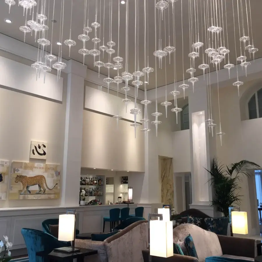 Distinguished melogranoblu Hydra Datura suspension lamp with hand-blown glass pendants and mirror-finish metal supporting colored metallic cords