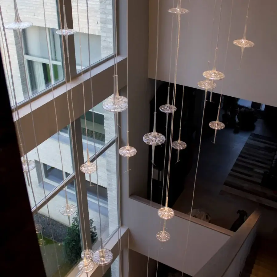 Distinguished melogranoblu Hydra Datura suspension lamp with a mirror finish ceiling light and fifteen hand-blown glass pendants suspended by colored metallic cords
