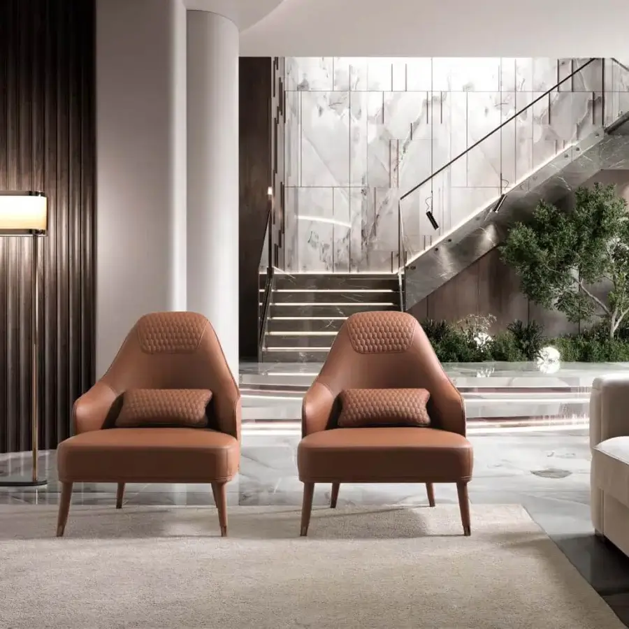 Distinguished DV Home Collection Manhattan lounge chair with solid wood frame and luxurious reddish-brown leather upholstery with satin finish legs