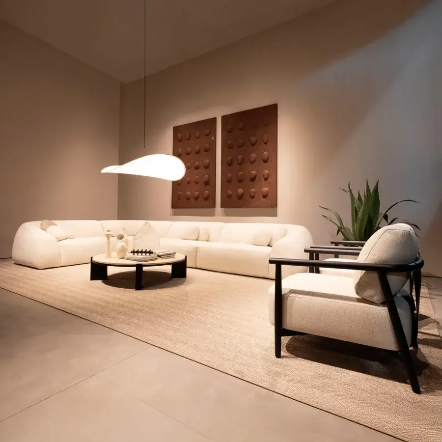 Elegant Verzelloni Charlot modular sofa with woven textile upholstery and a low, wide neutral beige profile