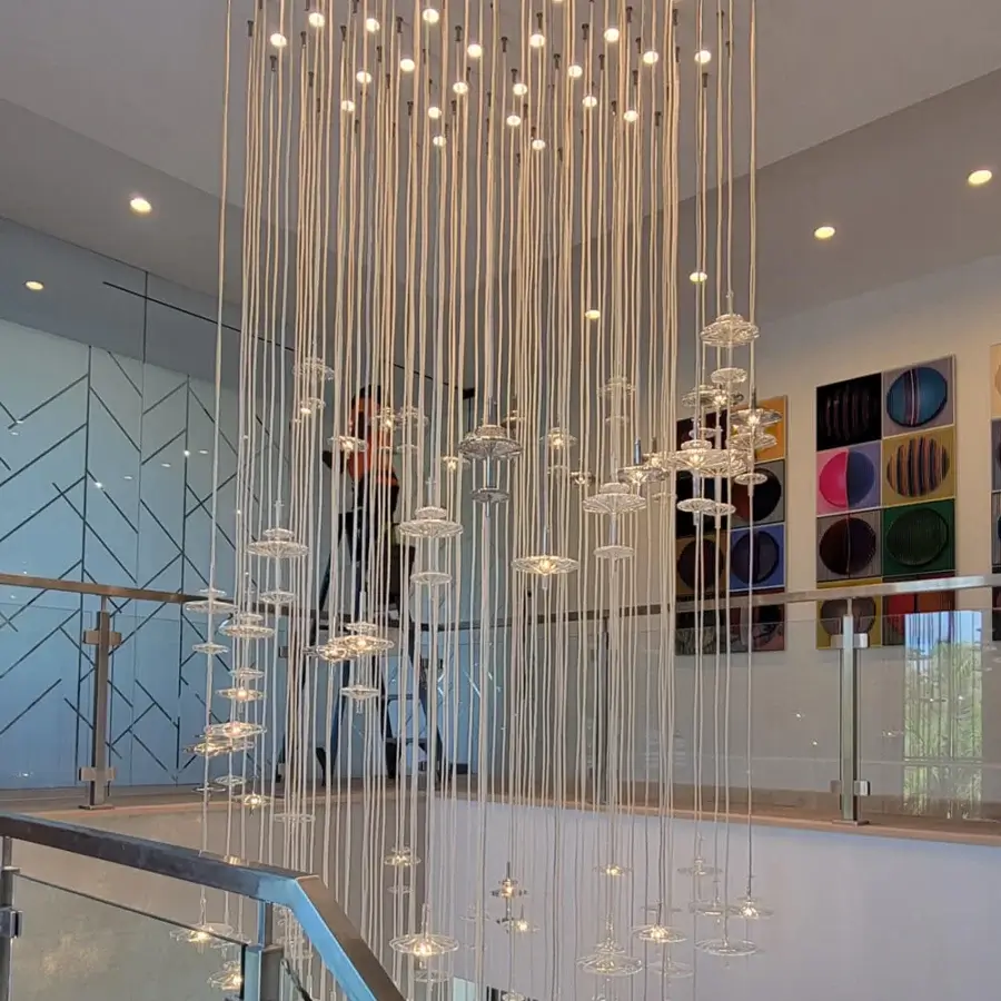 Lavish melogranoblu Hydra - Gamma suspension lamp with cascading translucent shades and bright silver metallic structure crafted in Italy