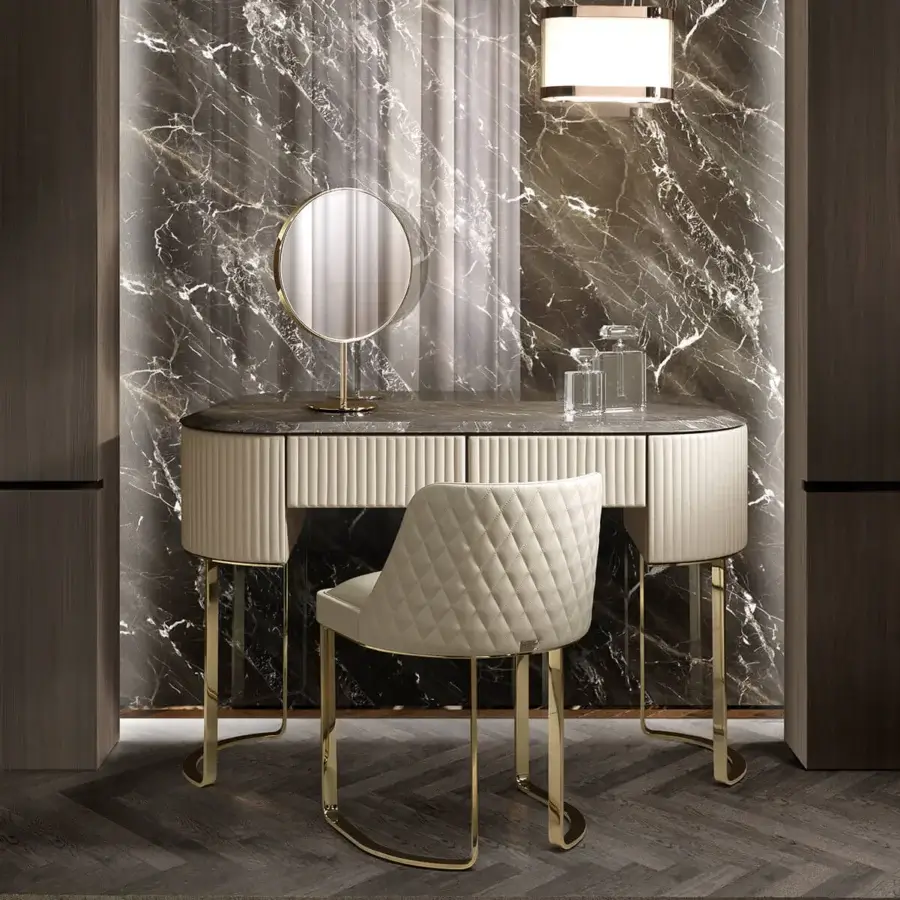 Elegant DV Home Collection Coco chair with beech plywood shell and light beige textile upholstery with diamond quilting and polished golden steel base