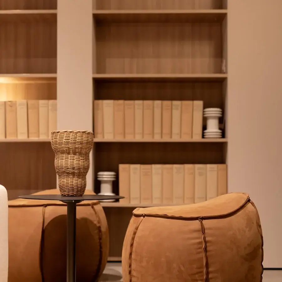 Superior Verzelloni Woody ottoman crafted with textured earthy brown fabric and multilayer wood frame with raw-edge stitching
