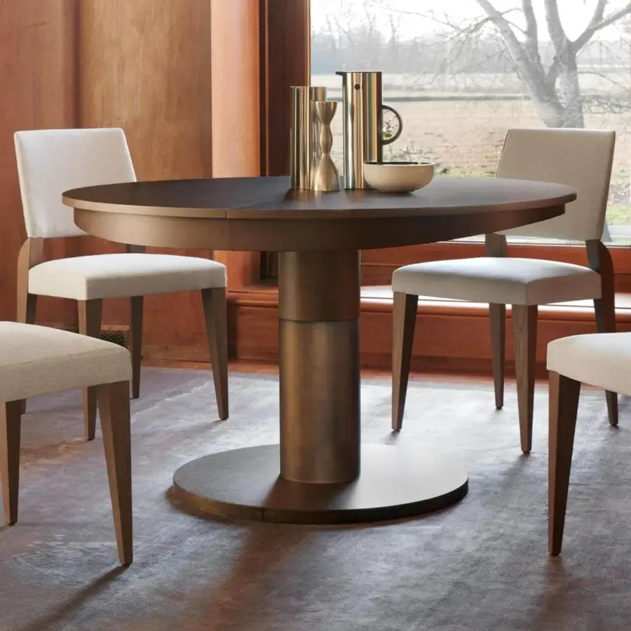 Elegant Potocco Diva table, a round extendable dining table with dark oak and a bronze-like metal pedestal base