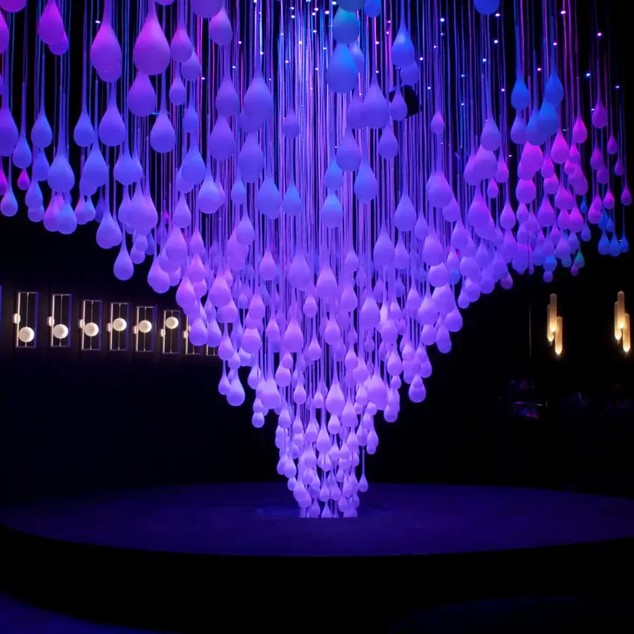 Captivating melogranoblu Hydra suspension lamp with hand-blown glass diffusers suspended from colored metallic cords and mirror finish ceiling light