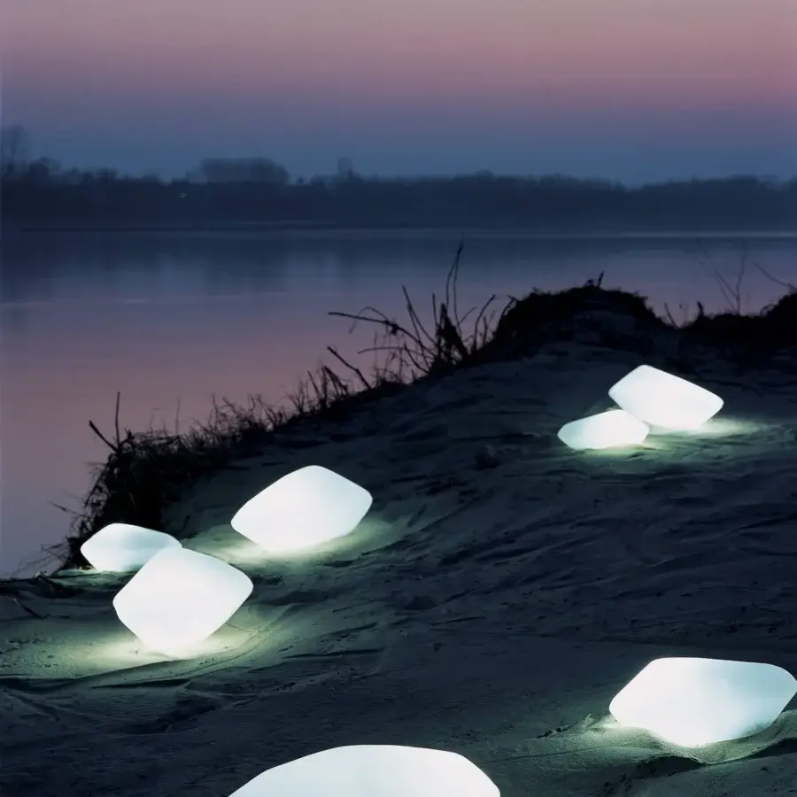 Superior Oluce Stones floor lamp crafted in Italy with subtly textured matte synthetic material diffusing soft cool white light