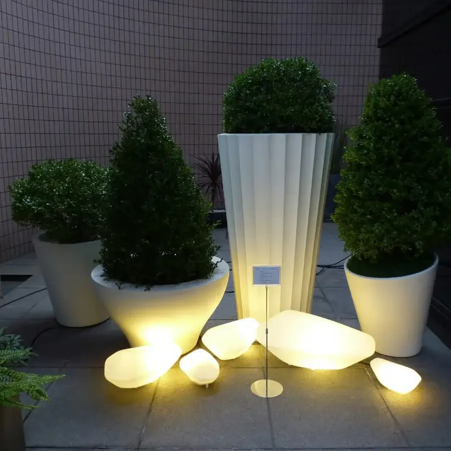 Distinguished Oluce Stones floor lamp crafted in Italy with organically shaped forms and warm white finish