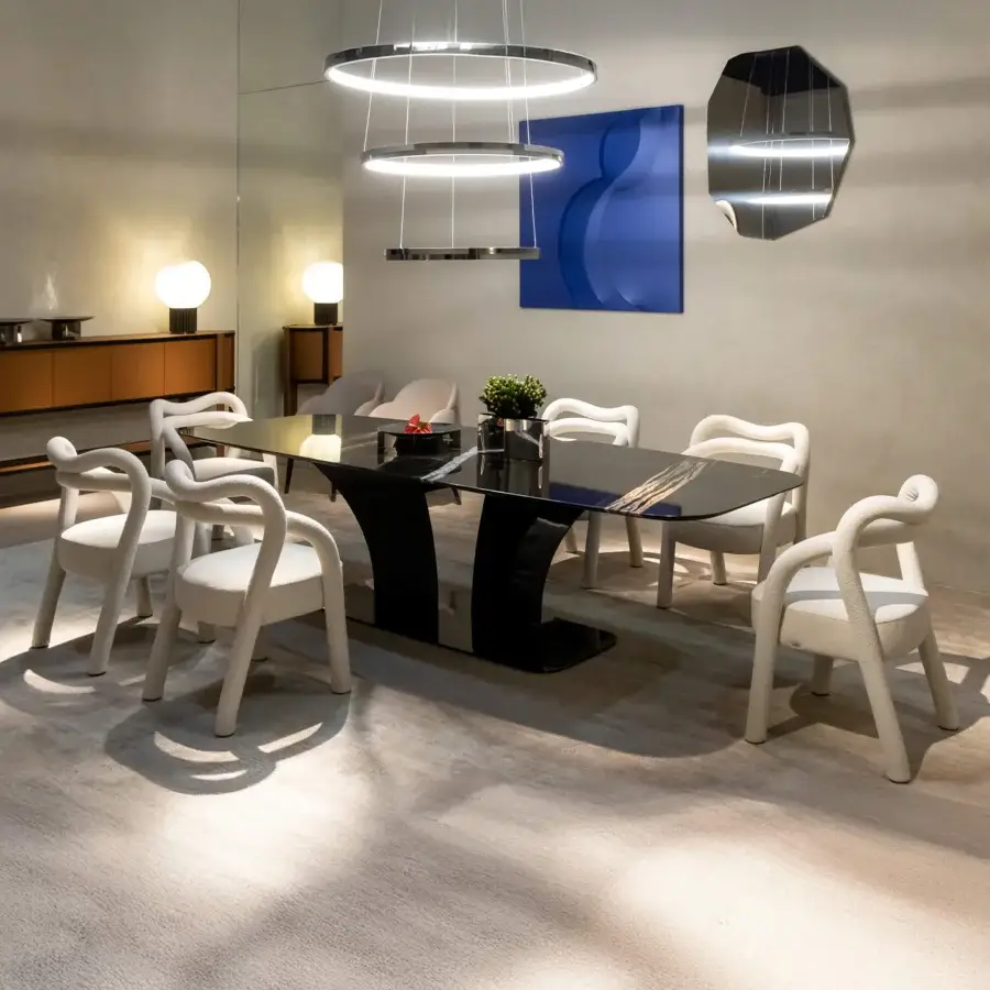 Distinguished Rugiano Abbraccio armchair with enveloping curved form and creamy off-white fabric upholstery crafted with bronzed brass details