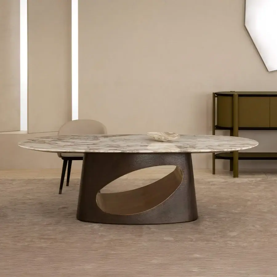 Superior Rugiano Ring table with light marble exhibiting beige and gray veining, built with a dark matte bronze base