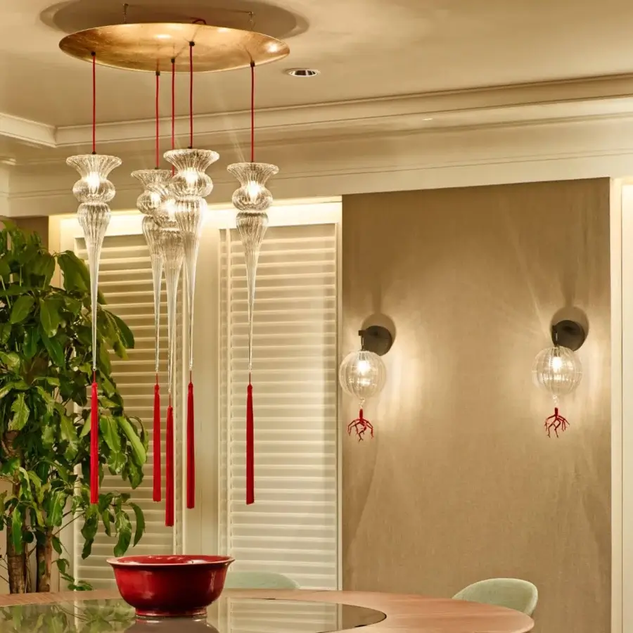 Superior melogranoblu Opera - Turandot suspension lamp crafted from ruled hand-blown glass with a vibrant red silk tassel and warm gold-toned metal mount