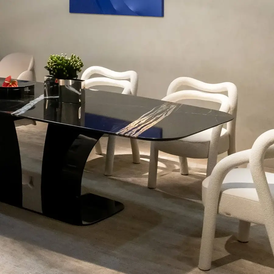 Captivating Rugiano Spectro table with a deep black marble tabletop and sculpted high-gloss dark-toned bronze base