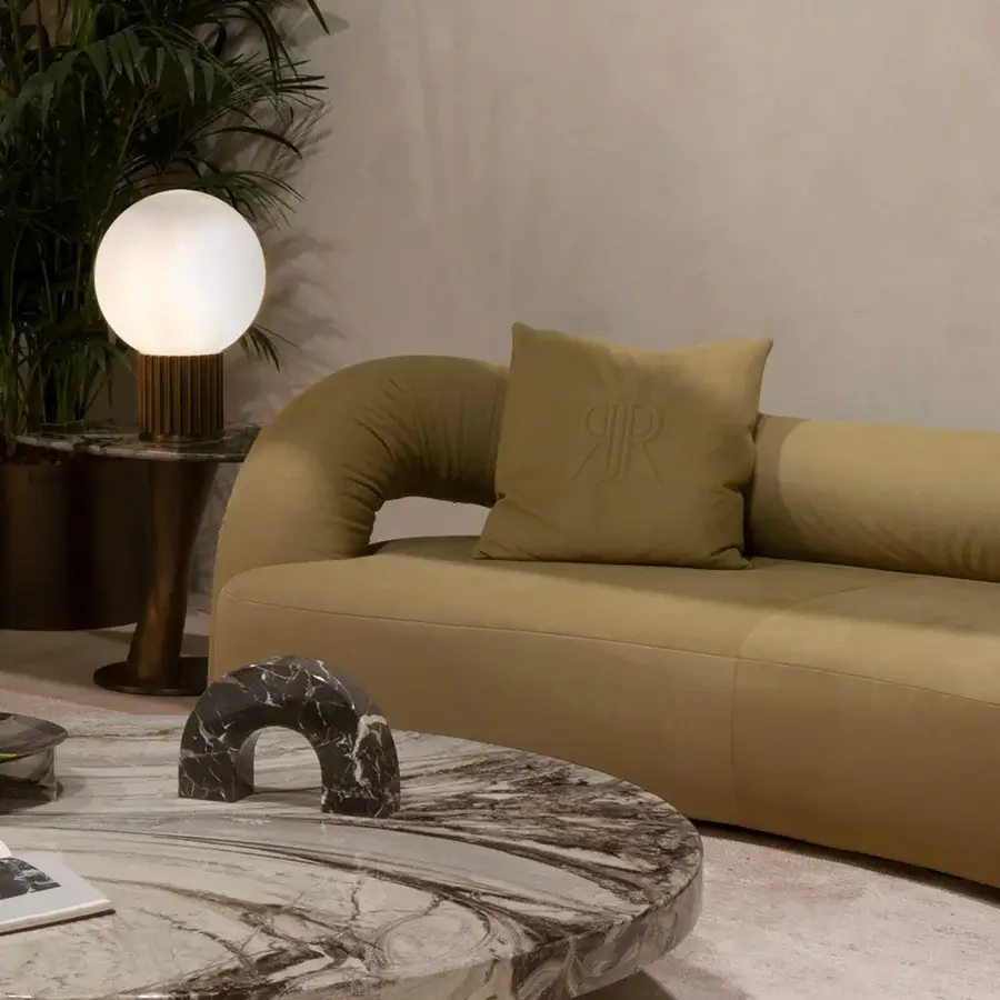 Superior Rugiano Abbraccio sofa with enveloping curved silhouette in olive green fabric or luxurious leather and bronzed brass details