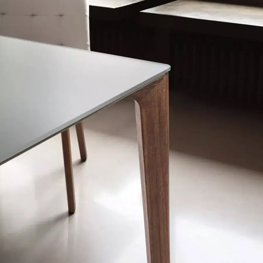 Elegant Bontempi Versus Square table crafted with steel frame and satin-finish grained wood legs in warm brown tones