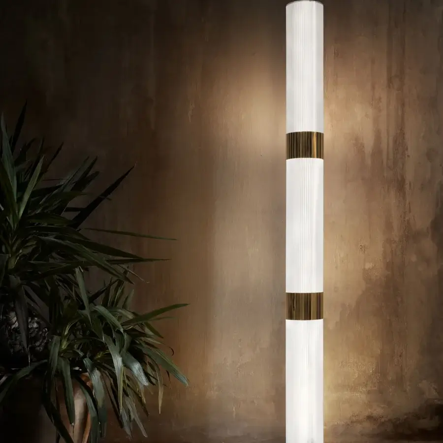 Elegant Slamp La Lollo floor lamp with translucent white Lentiflex® and gilded Steelflex® bands built with a polished steel base