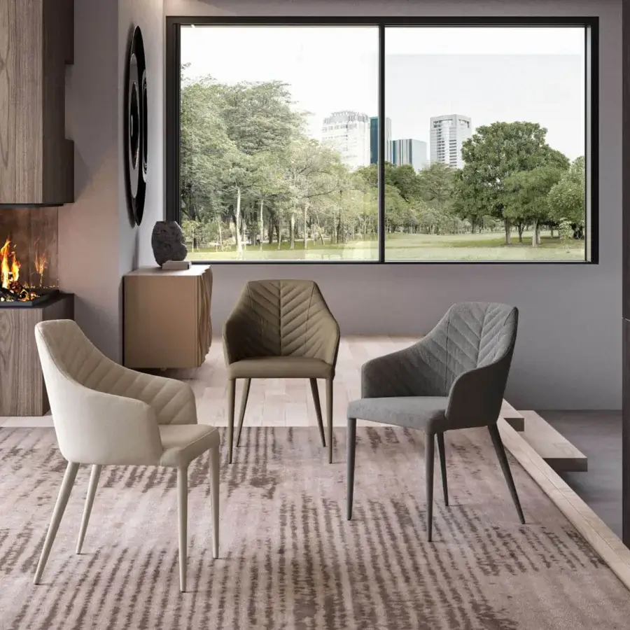 Exceptional Ozzio Italia Regiorgio armchair upholstered in muted gray Tango fabric and soft eco-leather nabuk with quilted beige interior and angled metal legs