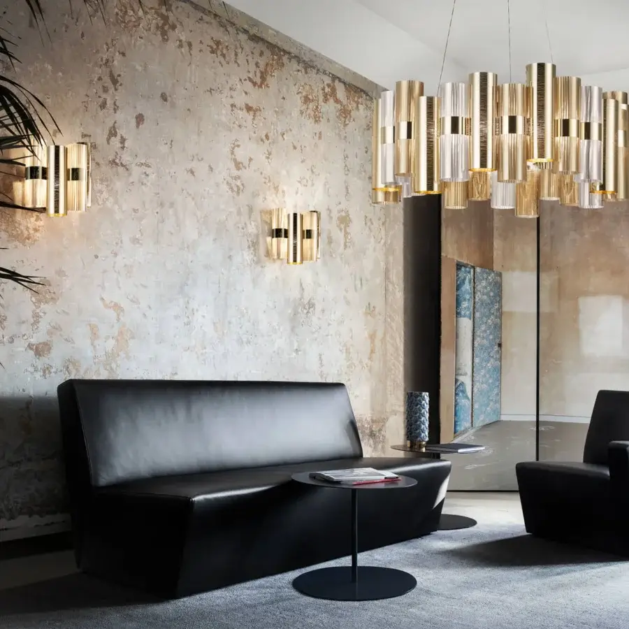 Superior Slamp La Lollo wall lamp crafted in Lentiflex® and Opalflex® technopolymers with a gradient golden finish and ribbed texture